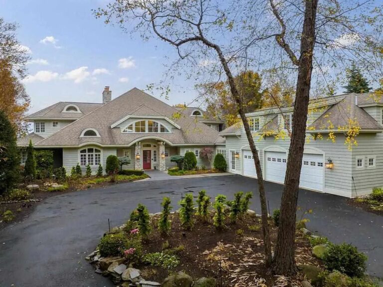 Sitting on a Perfectly Landscaped Lot with Breathtaking Views of Lake