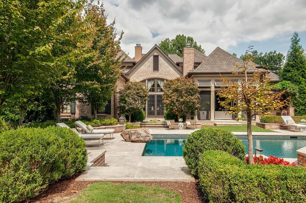 The Estate in Nashville is a luxurious home featuring stunning pool and spa, beautiful landscaping and outdoor kitchen now available for sale. This home located at 34 Lynnwood Ln, Nashville, Tennessee; offering 05 bedrooms and 08 bathrooms with 6,373 square feet of living spaces. 