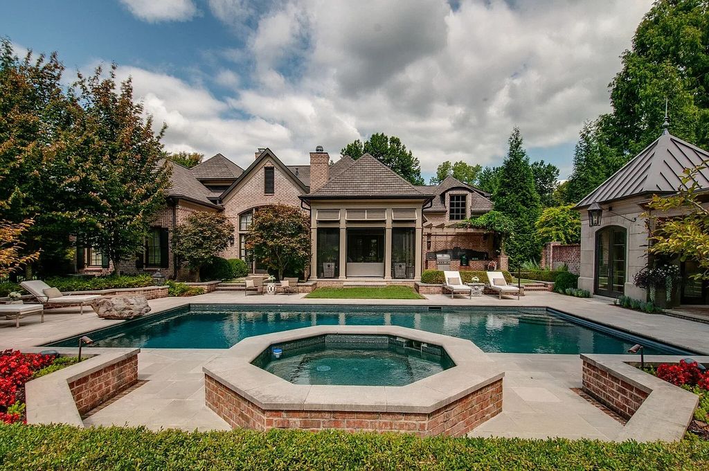 The Estate in Nashville is a luxurious home featuring stunning pool and spa, beautiful landscaping and outdoor kitchen now available for sale. This home located at 34 Lynnwood Ln, Nashville, Tennessee; offering 05 bedrooms and 08 bathrooms with 6,373 square feet of living spaces. 