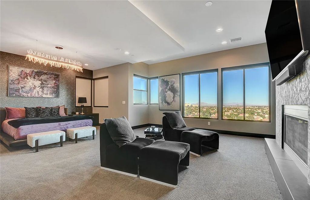 11296 Villa Bellagio Drive, Las Vegas, Nevada is a stunning modern home situated on an elevated lot within the highly sought after Bluffs at Tuscan Cliffs Southern Highlands guard gated community with breathtaking city, mountain and strip views.