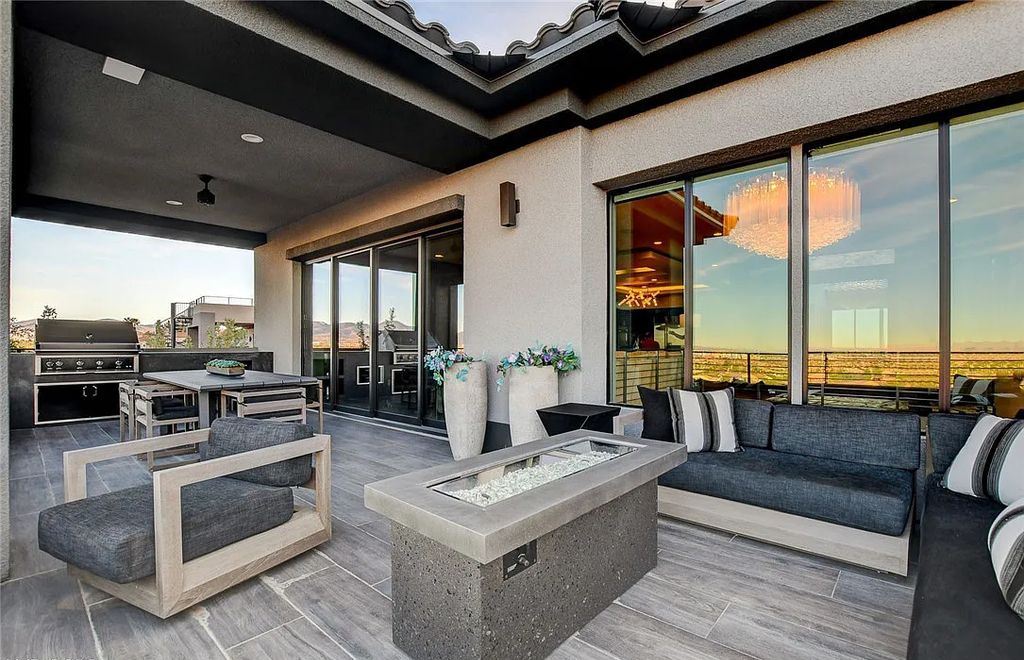 11296 Villa Bellagio Drive, Las Vegas, Nevada is a stunning modern home situated on an elevated lot within the highly sought after Bluffs at Tuscan Cliffs Southern Highlands guard gated community with breathtaking city, mountain and strip views.