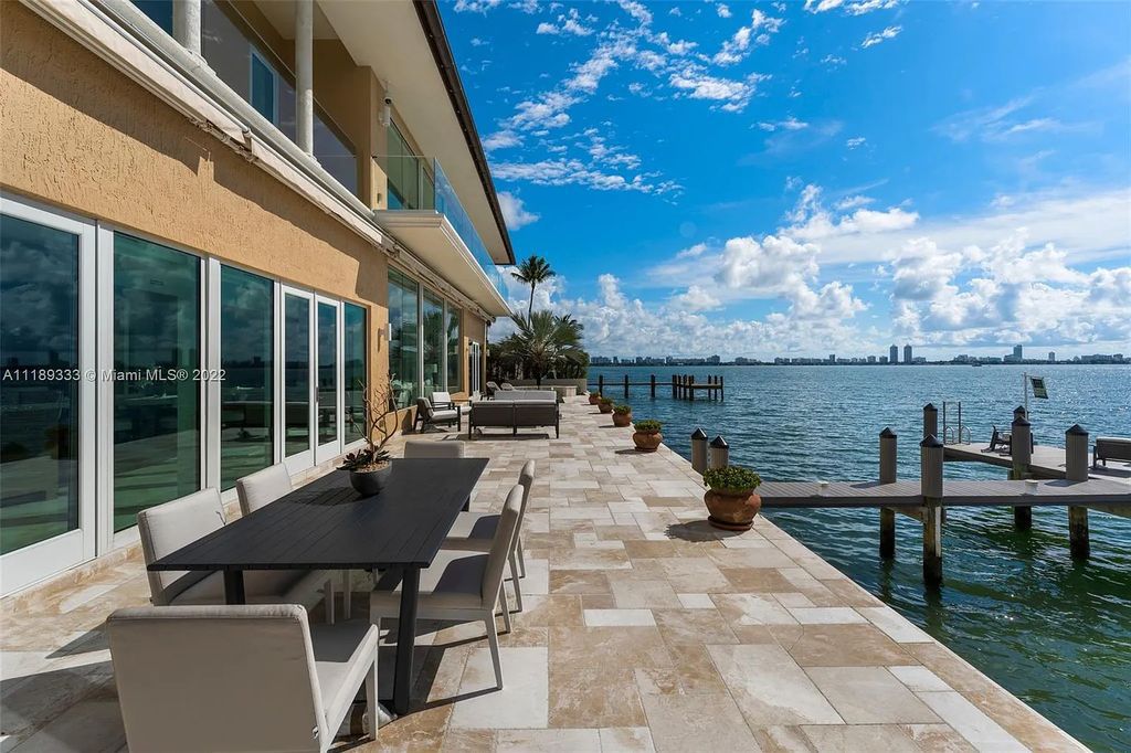 1357 Bay Terrace, North Bay Village, Florida, sits on an 8,858 SF lot with 103’ of water frontage, taking your breath away as you walk in. With a private dock and ocean access for your yacht, this home is designed to maximize water views from every angle, including direct Miami Skyline views. You can also experience breathtaking open bay views from this waterfront estate.