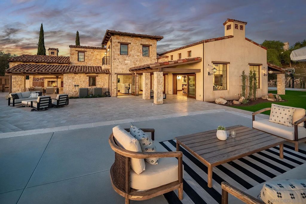8069 Entrada De Luz East, San Diego, California is an exquisite estate located on in one of the most exclusive, gated golf communities in San Diego, boasts total privacy, large living areas, open through disappearing doors to multiple covered patios.