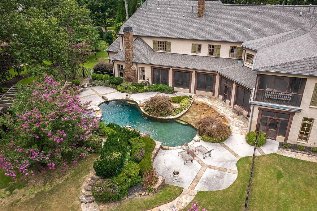 The House in Germantown offers resort style pool, screened porches, indoor basketball court, indoor kids playhouse, media room, play room, now available for sale. This home located at 2326 Johnson Rd, Germantown, Tennessee