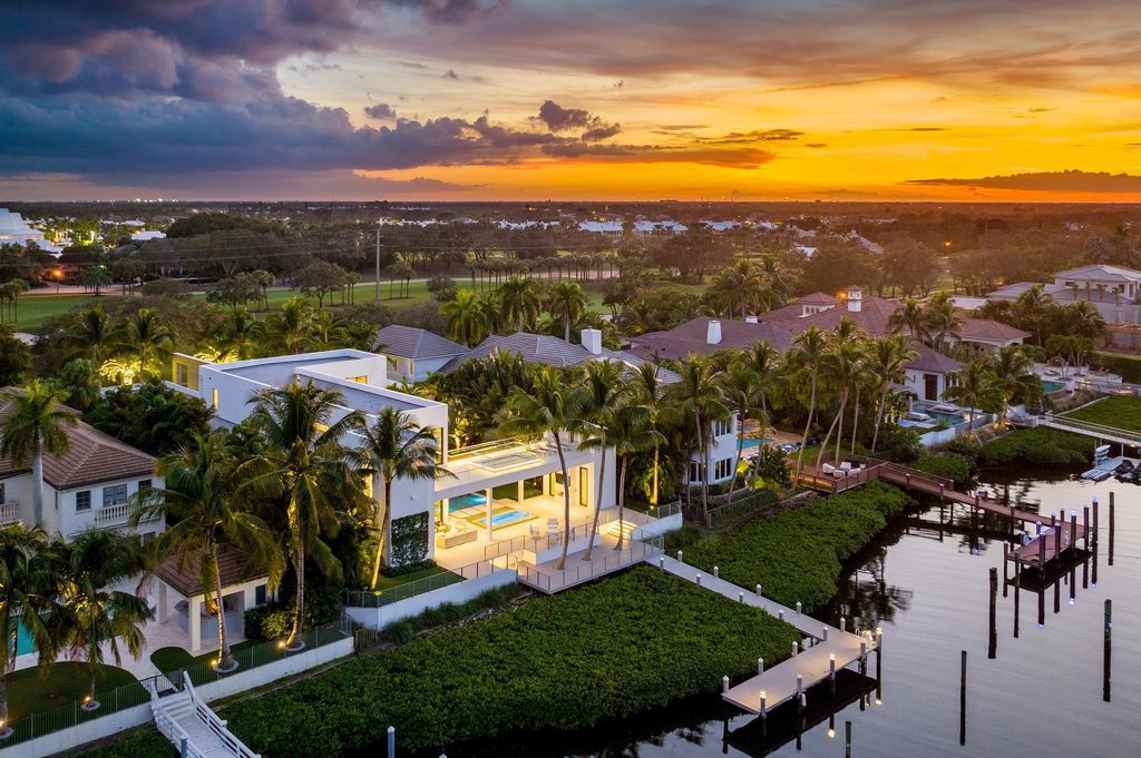 160 Spyglass Lane, Jupiter, Florida, stands out among the elegance of Jupiter’s coveted Admiral’s Cove, with intricate stone and wood finishes. A summer kitchen and 100 feet of pristine beach on the outside, with views of the Intracoastal Waterway, make this a truly delightful location.