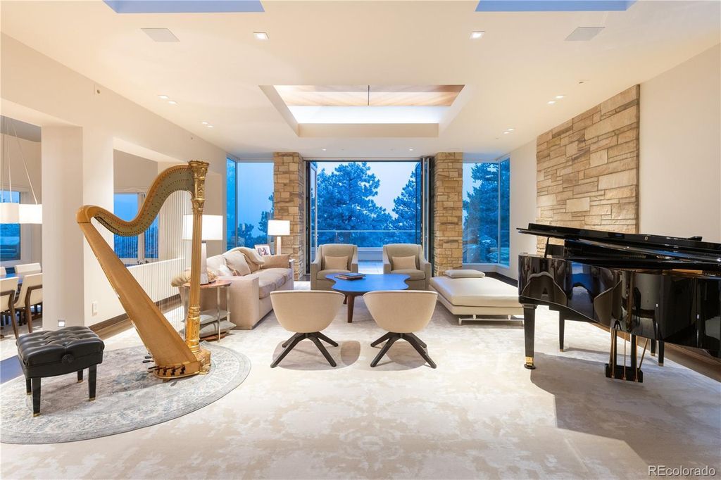 1733 Montane Drive East, Golden, Colorado is a modern mountain estate perched on top of a Genesee peak were designed to accentuate the cascading Rocky Mountain views from nearly every window.
