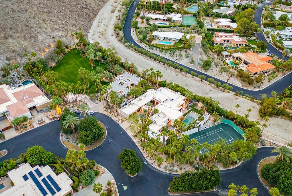 12 Evening Star Drive, Rancho Mirage, California is a tennis court estate property was created by a team of top design professionals and of the highest quality on 4 lots in the renowned Thunderbird Cove.
