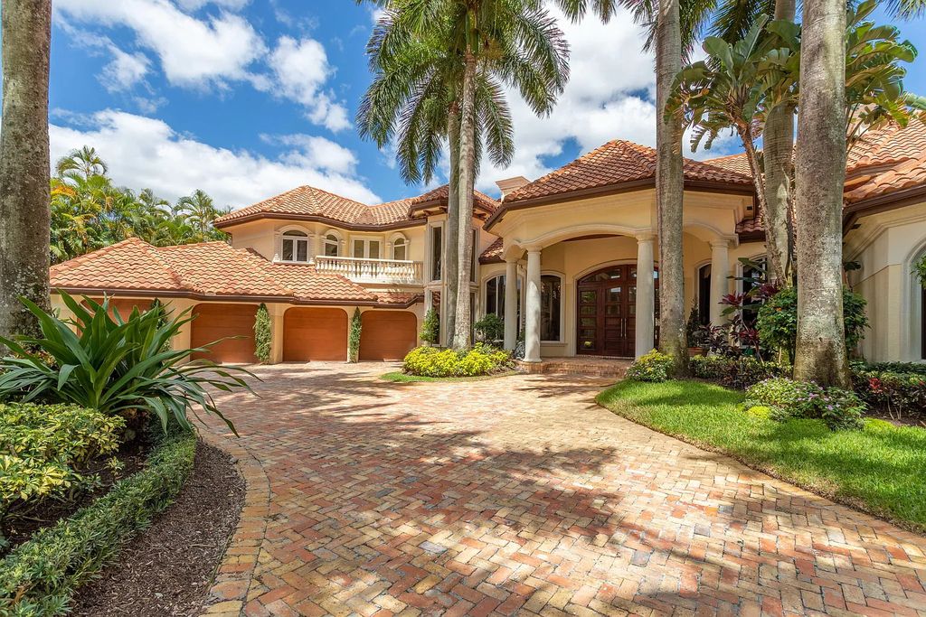 17951 Lake Estates Drive, Boca Raton, Florida is a estate style property and residence has exceptional waterfront vistas overlooking the rolling hills of the Arnold Palmer signature east course par five hole.