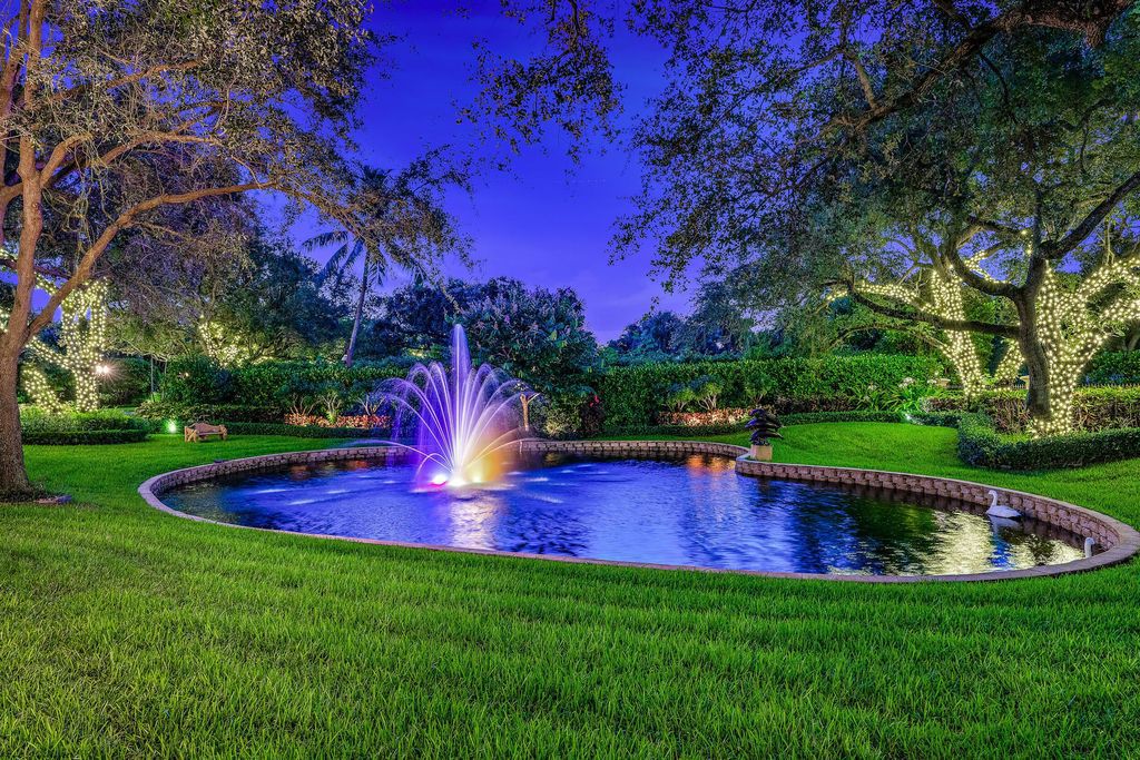 2330 Seven Oaks Lane, Palm Beach Gardens, Florida, offers unparalleled privacy and serenity on 2.6 acres with 150' of waterfrontage. The residence is built with stem walls and a concrete slab second floor in the heart of North County.