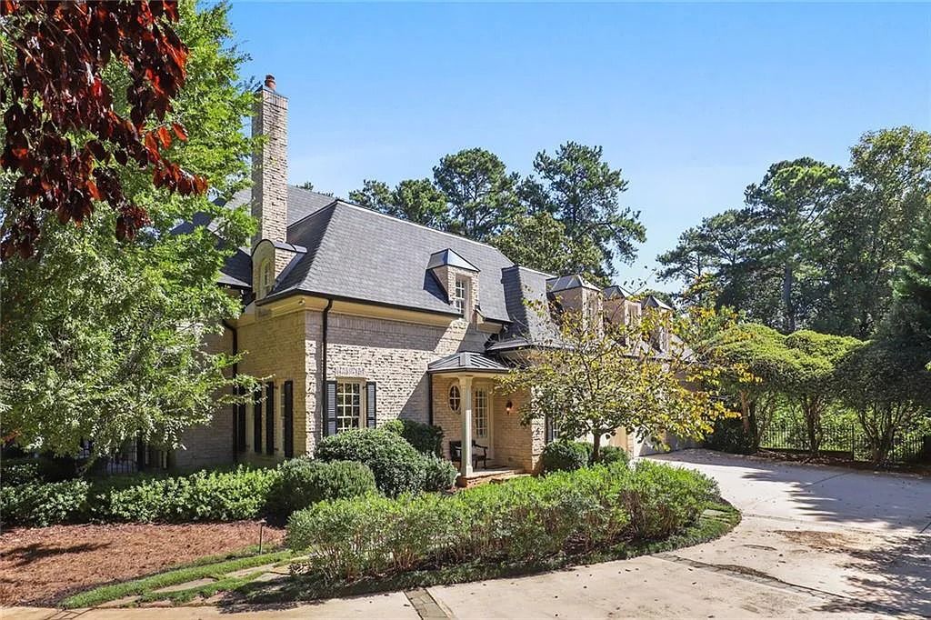 The Home in Sandy Springs offers great outdoor spaces, four fireplaces, 3-car garage and a pool, now available for sale. This home located at 305 Forrest Lake Dr, Sandy Springs, Georgia