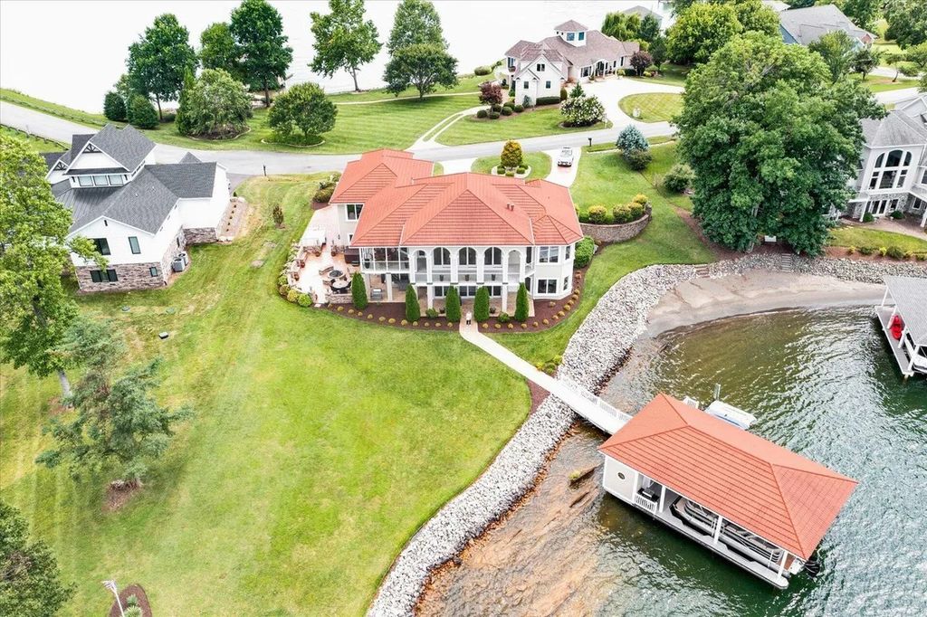 The Estate in Moneta is a luxurious home located in a park place to enjoy natural sandy beach views now available for sale. This home located at 999 Park Way Ave, Moneta, Virginia; offering 04 bedrooms and 06 bathrooms with 5,300 square feet of living spaces. 
