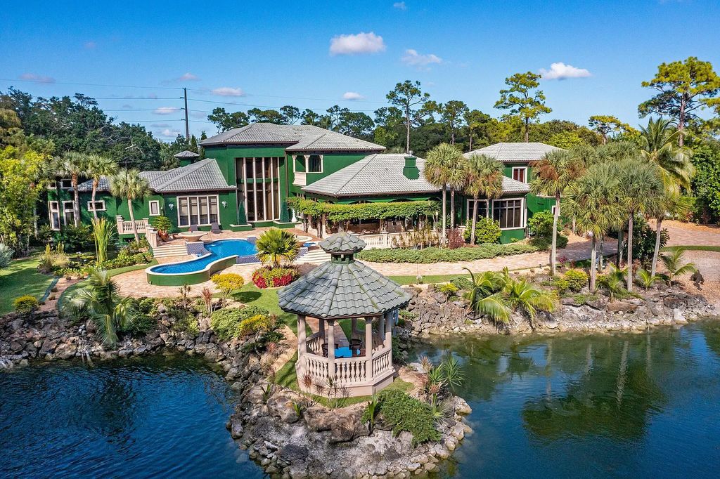 9614 Pondwood Road, Boca Raton, Florida, is a luxury villa in a five-acre private alcove in Boca Raton. Featuring a breathtaking 40-foot waterfall, two lakes, a koi pond, and vegetation from all corners of the globe, it is perfect for entertaining and relaxing.