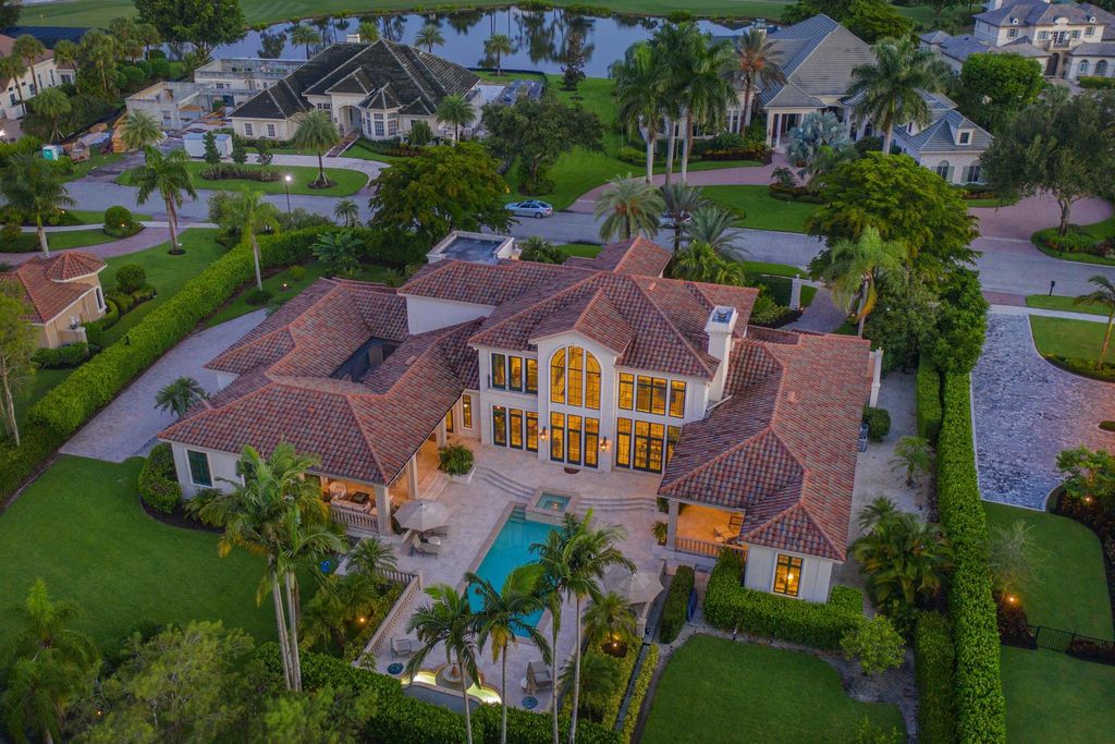 6547 Highcroft Drive, Naples, Florida is a landmark-built home with resort-like outdoor setting includes 2 covered lanais overlooking pool/spa, fountain and yard, new luxury appliances, new wet bar, new roof, new impact doors and windows, new fireplaces, new lighting and guest baths. 