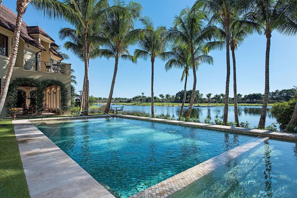 2140 Canna Way, Naples, Florida is a custom-built French country estate was finished with cut-stone exterior, Ludowici clay tile roof and dual-pane hurricane-rated mahogany doors, windows. 