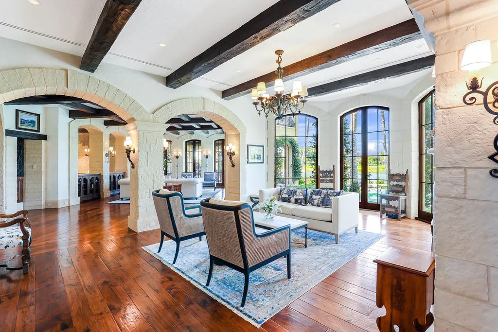 2140 Canna Way, Naples, Florida is a custom-built French country estate was finished with cut-stone exterior, Ludowici clay tile roof and dual-pane hurricane-rated mahogany doors, windows. 
