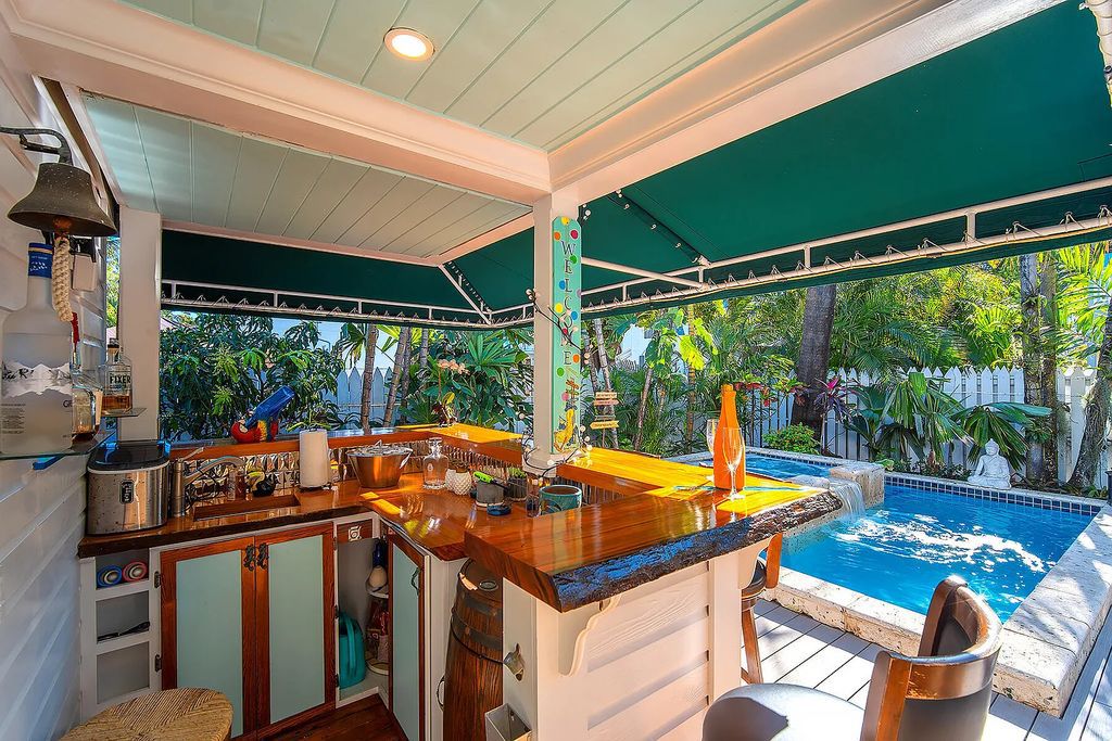 408 United Street, Key West, Florida, located in the most sought after location in Old Town, nestled between world famous Duval St & Whitehead St, mere steps to the beach, Southernmost Point, restaurants. This Trophy residence sits on a premium 5,109 sq ft lot, with abundant exotic tropical landscaping.