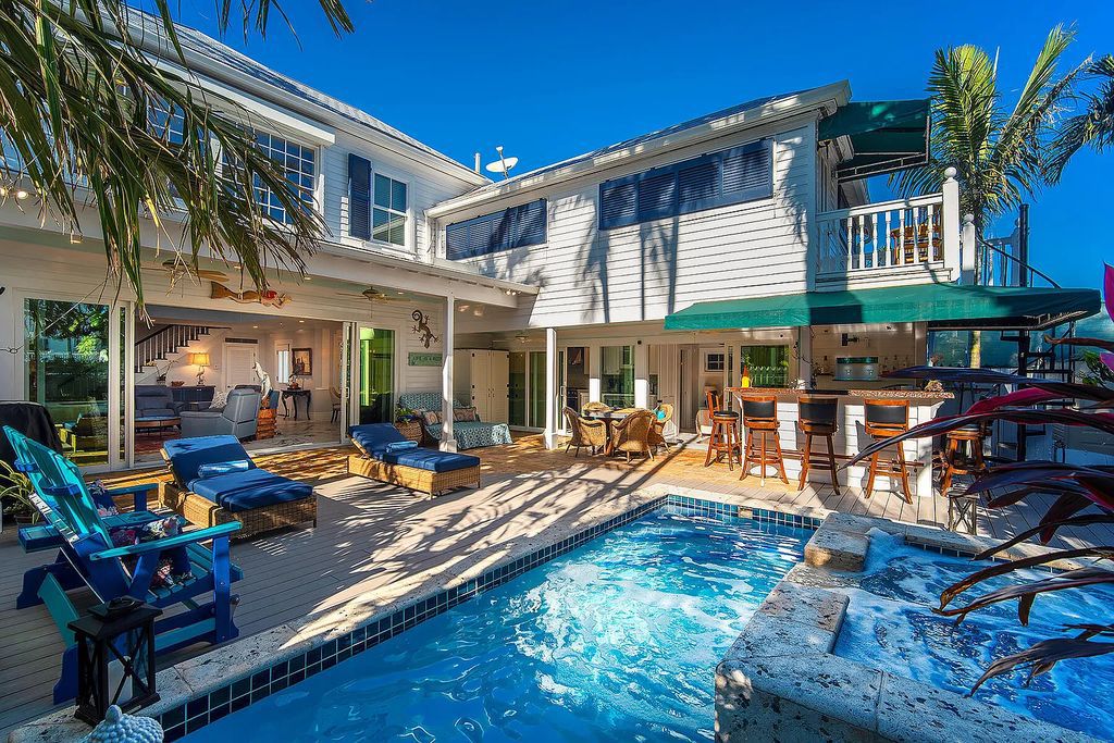 408 United Street, Key West, Florida, located in the most sought after location in Old Town, nestled between world famous Duval St & Whitehead St, mere steps to the beach, Southernmost Point, restaurants. This Trophy residence sits on a premium 5,109 sq ft lot, with abundant exotic tropical landscaping.