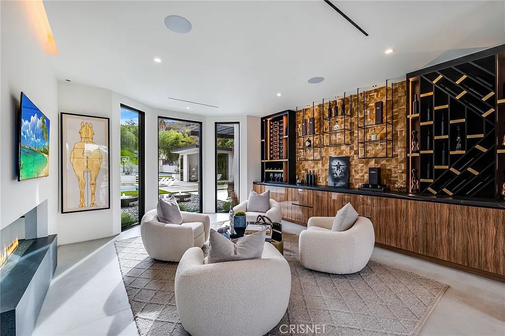 20620 Chatsboro Drive, Woodland Hills, California is an impeccably remodeled Smart home in the guard-gated Westchester County Estates community with gorgeous flooring and crisp white tones are bathed in abundant sunlight by multiple large windows with contrasting black trim.