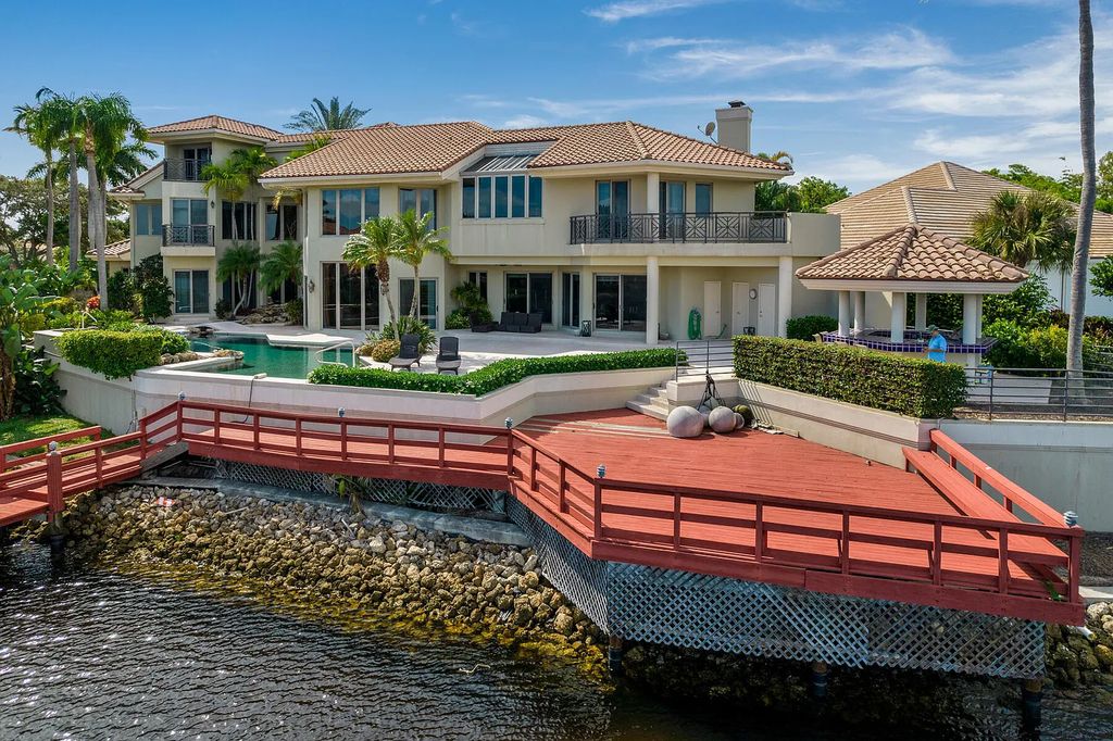 217 Commodore Drive, Jupiter, Florida is a stunning property sit on one of the largest water frontage lots on Commodore Island surrounded by new custom estates, a resort style pool with stunning orange sunsets and intracoastal activity.