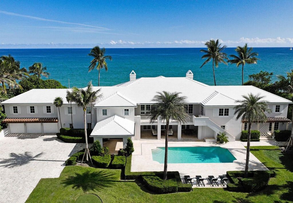 1120 S Ocean Boulevard, Manalapan, Florida is a beautiful beachfront estate stretches an impressive 193' of water frontage across each of the beach and lake coastlines and is equipped with a private dock that can support vessels up to 40' and a brand new seawall.