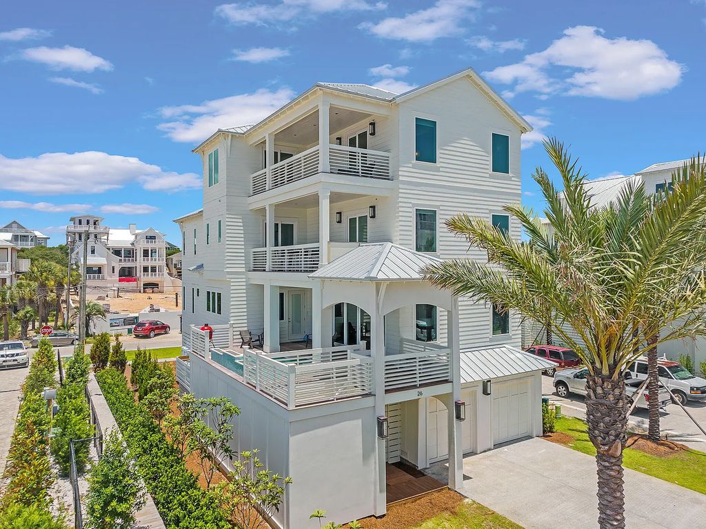 26 Palm Court Lane, Inlet Beach, Florida is an exceptional home boasts Notable architectural elements paired with lush landscaping & foliage provide a beautiful sense of arrival while optimal conveniences such as a private elevator accessing all floors create unmatched functionality.