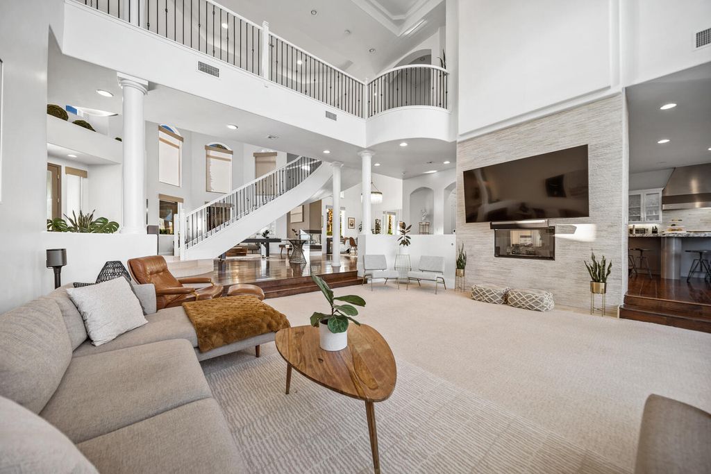 2000 Bogart Court, Las Vegas, Nevada is a one of a kind home situated on a cul-de-sac inside a private gated community featuring stunning finishes throughout with Limestone and hardwood flooring, quartzite fireplace, motorized window shades and grand 24” foot ceilings.
