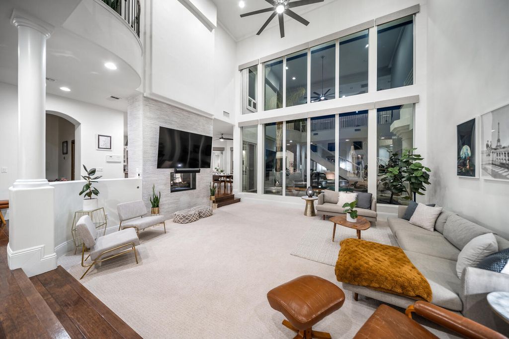 2000 Bogart Court, Las Vegas, Nevada is a one of a kind home situated on a cul-de-sac inside a private gated community featuring stunning finishes throughout with Limestone and hardwood flooring, quartzite fireplace, motorized window shades and grand 24” foot ceilings.