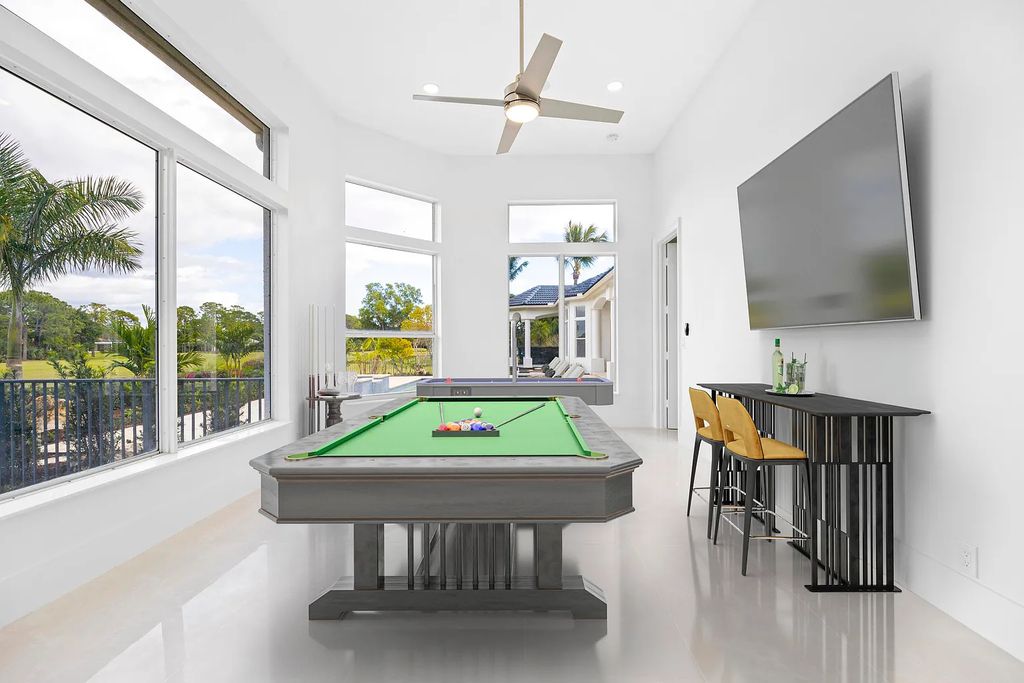 11795 Littlestone Court, Palm Beach Gardens, Florida is a stunning renovated one story house with golf views overlooking the PGA National Golf Course, filled with sunlight rooms, stylish welcoming spaces offering areas for intimate or grand-scale gatherings.