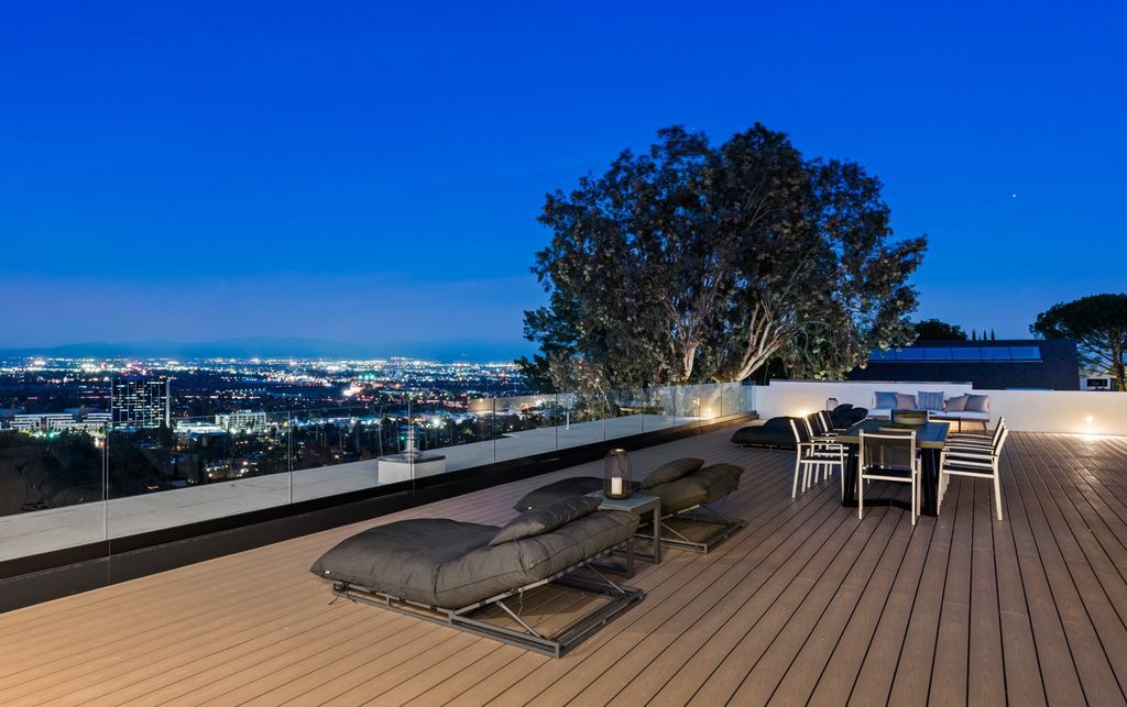 4125 Royal Crest Place, Encino, California is a 2022 new construction estate with breathtaking panoramic views of San Fernando Valley and its surrounding cities set on a quiet cul-de-sac street, truly one-of-a-kind.