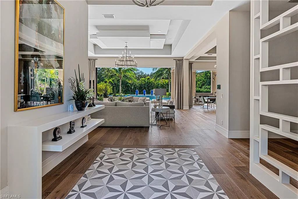 112 Hickory Road, Naples, Florida, built in 2020 by the award-winning McGarvey Custom Homes. With nearly 700sf outdoor entertaining area with fireplace and outdoor kitchen, this masterpiece will please the most discriminating homeowner