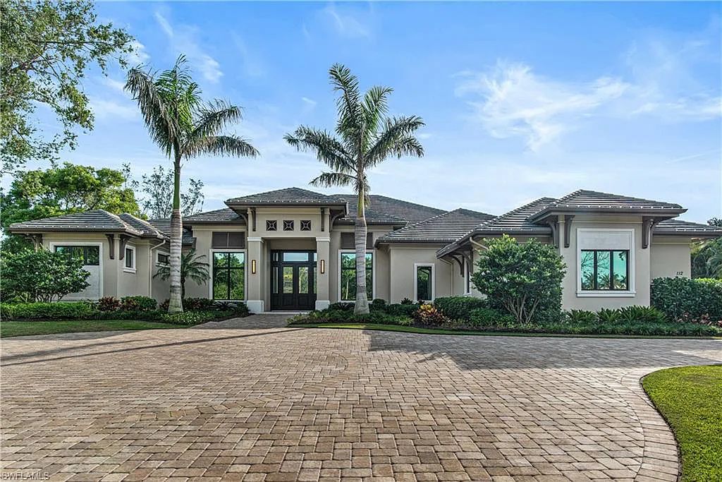 112 Hickory Road, Naples, Florida, built in 2020 by the award-winning McGarvey Custom Homes. With nearly 700sf outdoor entertaining area with fireplace and outdoor kitchen, this masterpiece will please the most discriminating homeowner