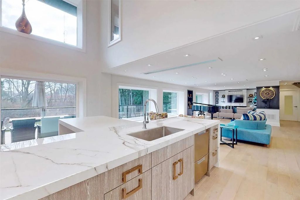 The Estate in Ontario is a luxurious home offering expansive floor-to-ceiling glass windows, custom kitchen with high- end appliances now available for sale. This home located at 7 Albion Clos, Markham, Ontario, Canada; offering 04 bedrooms and 05 bathrooms with 1 acre of land.