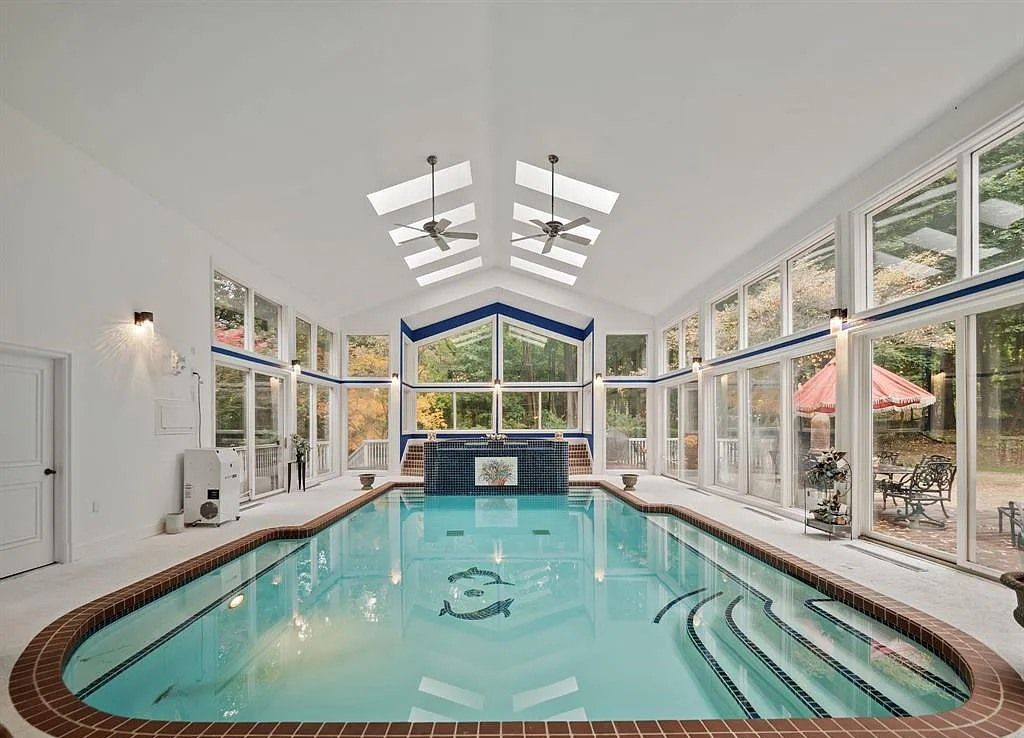 The Home in Bloomfield Hills is a majestic executive home with indoor pool and finished walkout lower-level, now available for sale. This home located at 859 Sunningdale Dr, Bloomfield Hills, Michigan