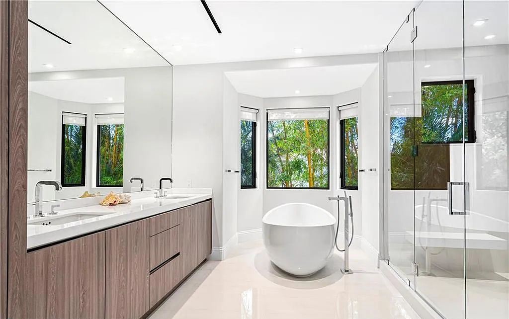 1515 Middle River Drive, Fort Lauderdale, Florida is a fully renovated home with the finest finishes including top of the Line Hansgrohe fixtures, private media room, Jerusalem tile and driftwood flooring, upstairs/downstairs laundry appliances for convenience and more. 