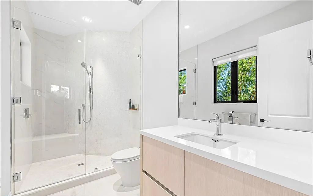 1515 Middle River Drive, Fort Lauderdale, Florida is a fully renovated home with the finest finishes including top of the Line Hansgrohe fixtures, private media room, Jerusalem tile and driftwood flooring, upstairs/downstairs laundry appliances for convenience and more. 