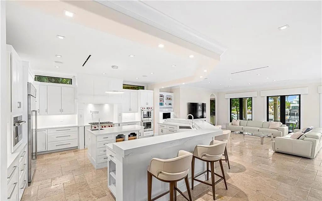 1515 Middle River Drive, Fort Lauderdale, Florida is a fully renovated home with the finest finishes including top of the Line Hansgrohe fixtures, private media room, Jerusalem tile and driftwood flooring, upstairs/downstairs laundry appliances for convenience and more. 