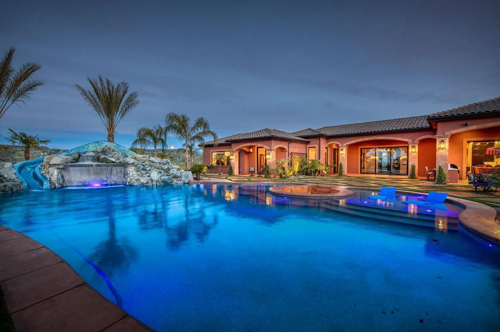 22137 Oak Glen Lane, Friant, California is a newly constructed home boasts 360 degree views of the snow-capped Sierras, Millerton Lake, Eagle Springs Golf Course and the City, enjoying the massive resort-style pool which includes a waterslide, private grotto and recessed fire pit.