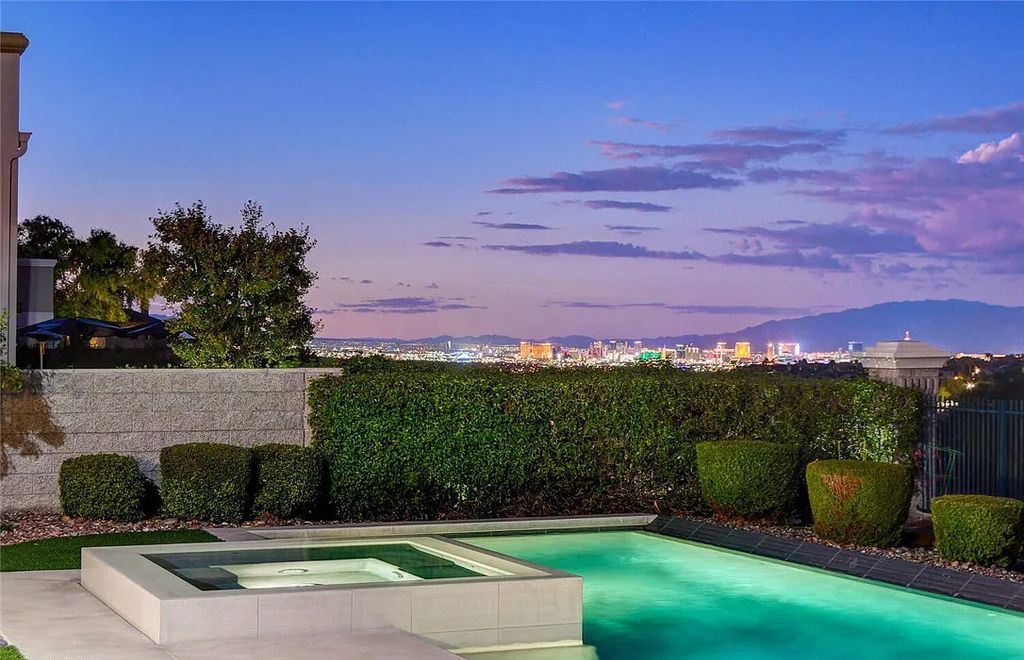 1370 Opal Valley Street, Henderson, Nevada is a spectacular home in Luxurious Seven Hills Estates boasting Las Vegas Strip views and marvelous backyard with covered patio, refreshing pool and spa, new outdoor kitchen and raised seating area.