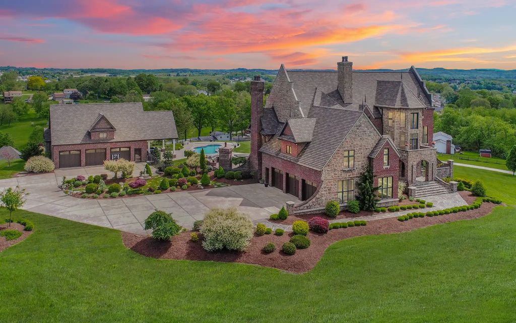 The Home in Irwin boasts an outdoor kitchen, swimming pool and manicured grounds with meticulous landscaping, now available for sale. This home located at 100 Dunrobin Ln, Irwin, Pennsylvania