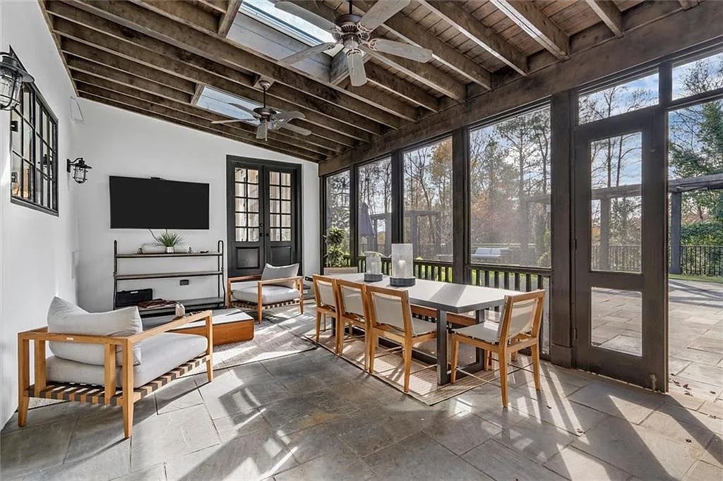 The House in Atlanta offers the lush green resort-style outdoor living with the saltwater heated pool and spa, dramatic lounge-side fireplace, and more now available for sale. This home located at 172 Blackland Dr NW, Atlanta, Georgia