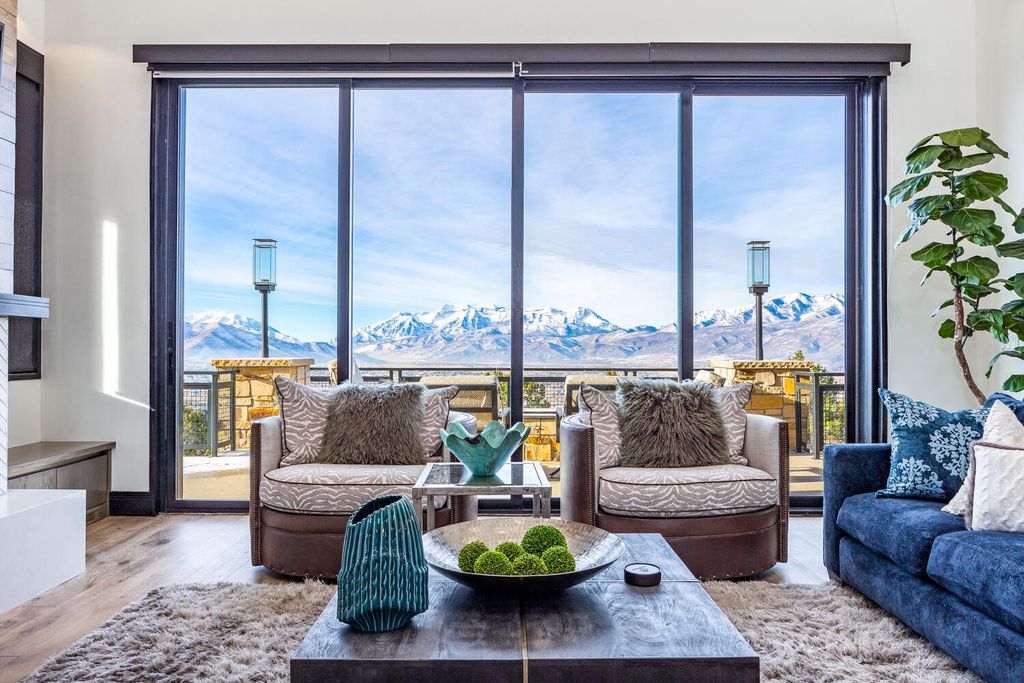 795 N Explorer Peak Drive, Heber City, Utah is a mountain contemporary home situated atop one of the most prominent ridgelines in Red Ledges, there are 2 large open living areas perfect for entertaining that includes a lower-level custom kitchen and theatre.