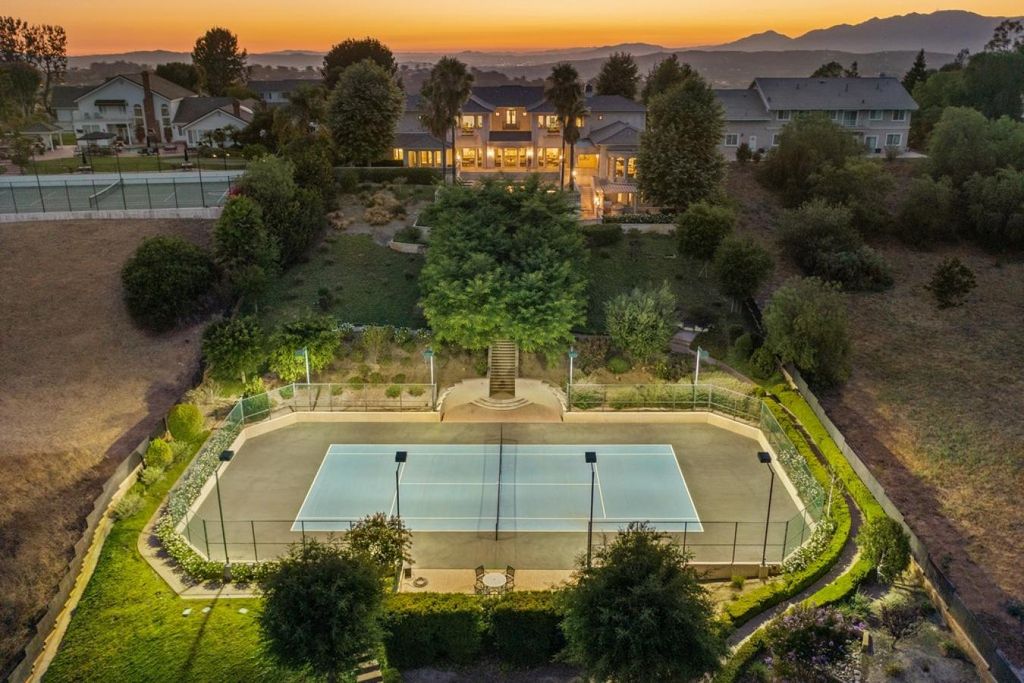1626 Derringer Lane, Diamond Bar, California is an entertainer's dream home in a highly secure community with the utmost privacy and unique amenities including a tennis court, pool and spa, children's playground, private well, subterranean parking for 8-10 cars and more.