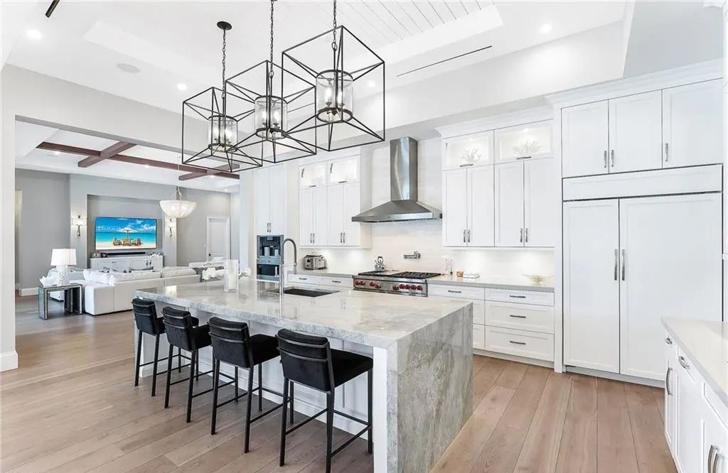 450 14th Ave South, Naples, Florida is a showcase of timeless sophistication with an Olde Florida twist and designer touches throughout near with superb dining and shopping options and a stone’s throw from the powder-soft sandy beach and tranquil Gulf waters.