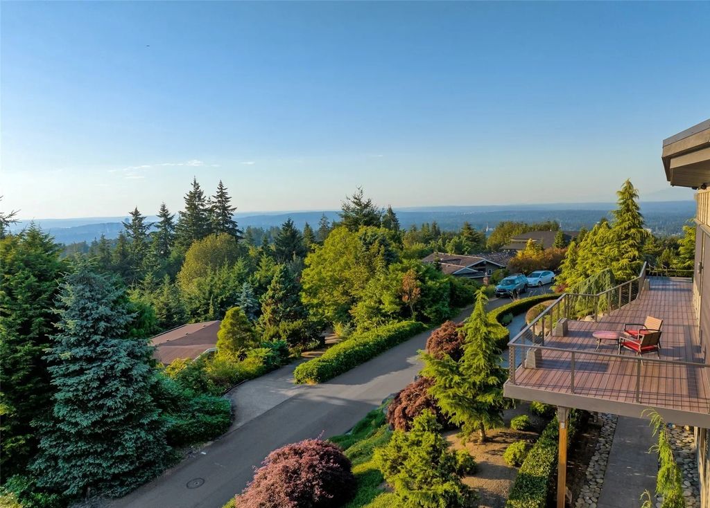 The House in Bellevue is a custom-built home with mesmerizing views of the lake, Seattle and beyond now available for sale. This home located at 5110 145th Place SE, Bellevue, Washington