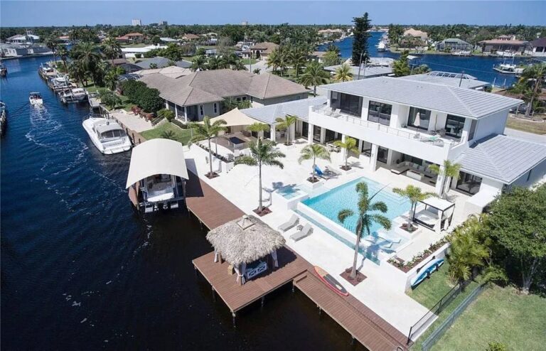 The 2-Story Contemporary House Sits on 3- SITE Lot at Intersecting Direct Access Canals in Cape Coral, Florida Asking for $3.5 Million