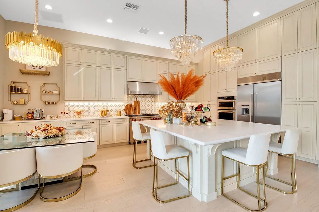 9016 Chauvet Way, Boca Raton, Florida, is built in the highly desired community of Boca Bridges and has more than 5000 square feet. This home is beautifully appointed with custom window treatments, stunning chandeliers, high-end furnishings and glamorous decor throughout.