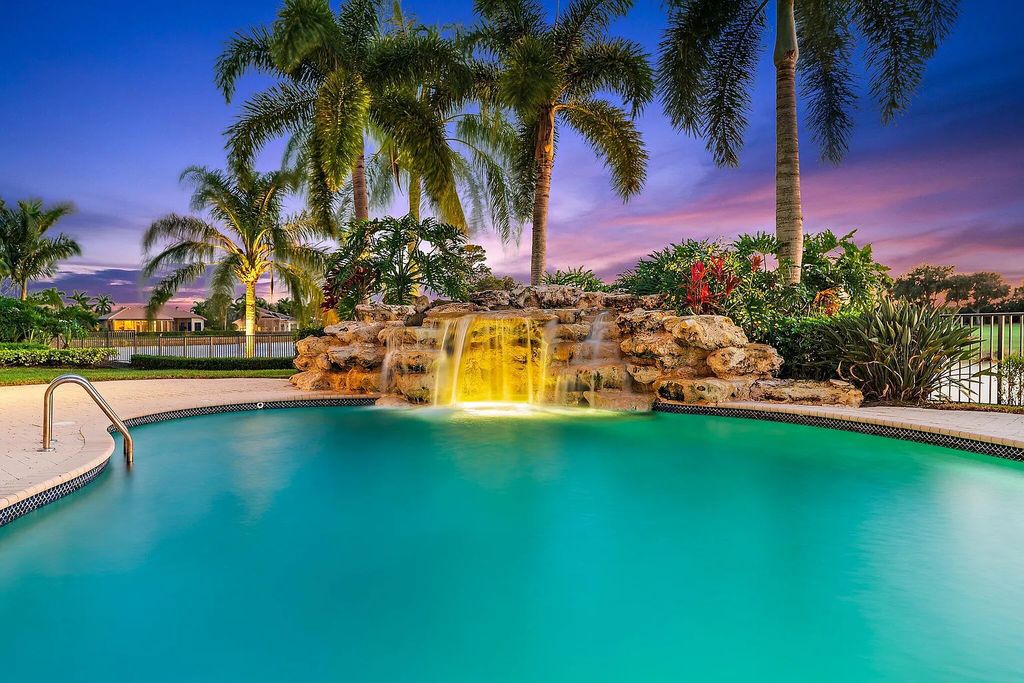 10520 Hawks Landing Terrace, West Palm Beach, Florida, is the magnificent estate home of Ibis Golf and Country Club, with 247 feet of water and golf frontage.