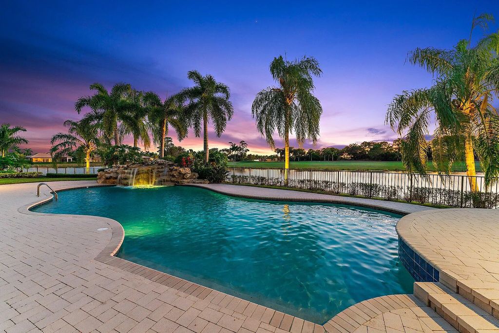 10520 Hawks Landing Terrace, West Palm Beach, Florida, is the magnificent estate home of Ibis Golf and Country Club, with 247 feet of water and golf frontage.