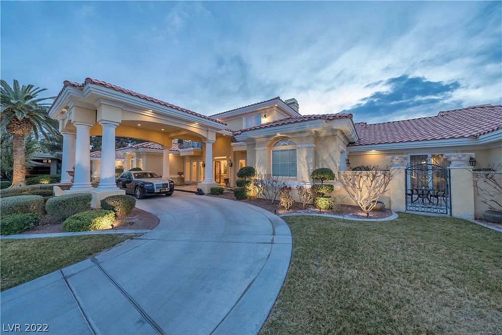 7600 Silver Meadow Court, Las Vegas, Nevada is a resort style estate in an exclusive gated enclave with a generous circular drive, a spacious living room punctuated by a stunning wrought iron floating staircase, a gourmet kitchen, venetian gardens, resort guest house and more.