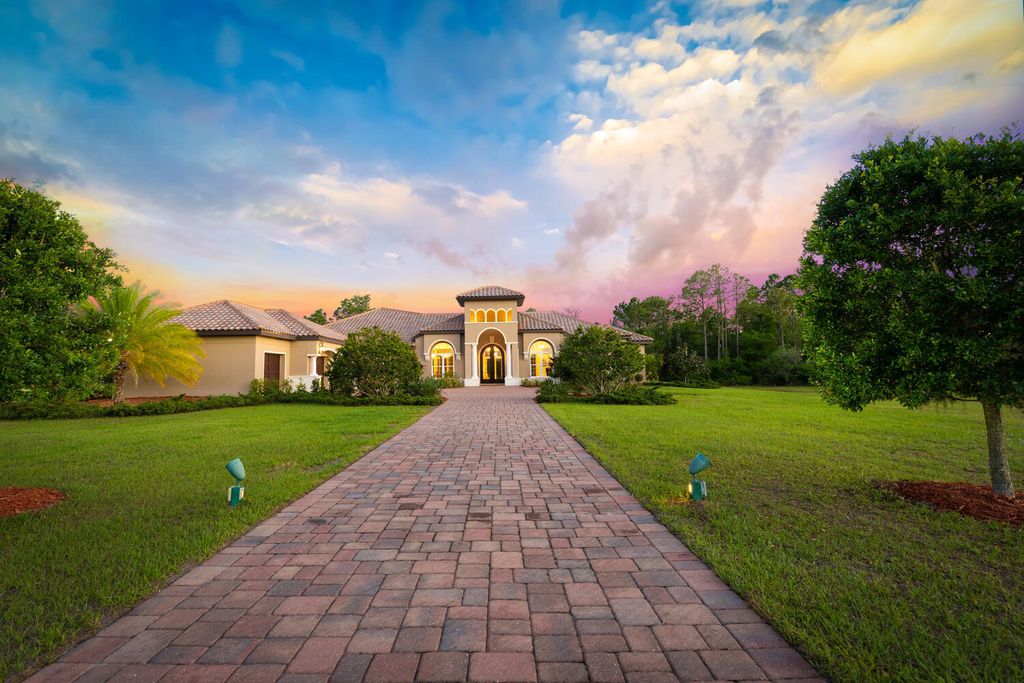 20706 79th Ave East, Bradenton, Florida is a gorgeous custom-built home situated on 7.65 acres and was built in 2014 by Denny Yoder of Yoder Homes and combines exquisite design with quality and comfort to meet all that is needed to live the Florida lifestyle.